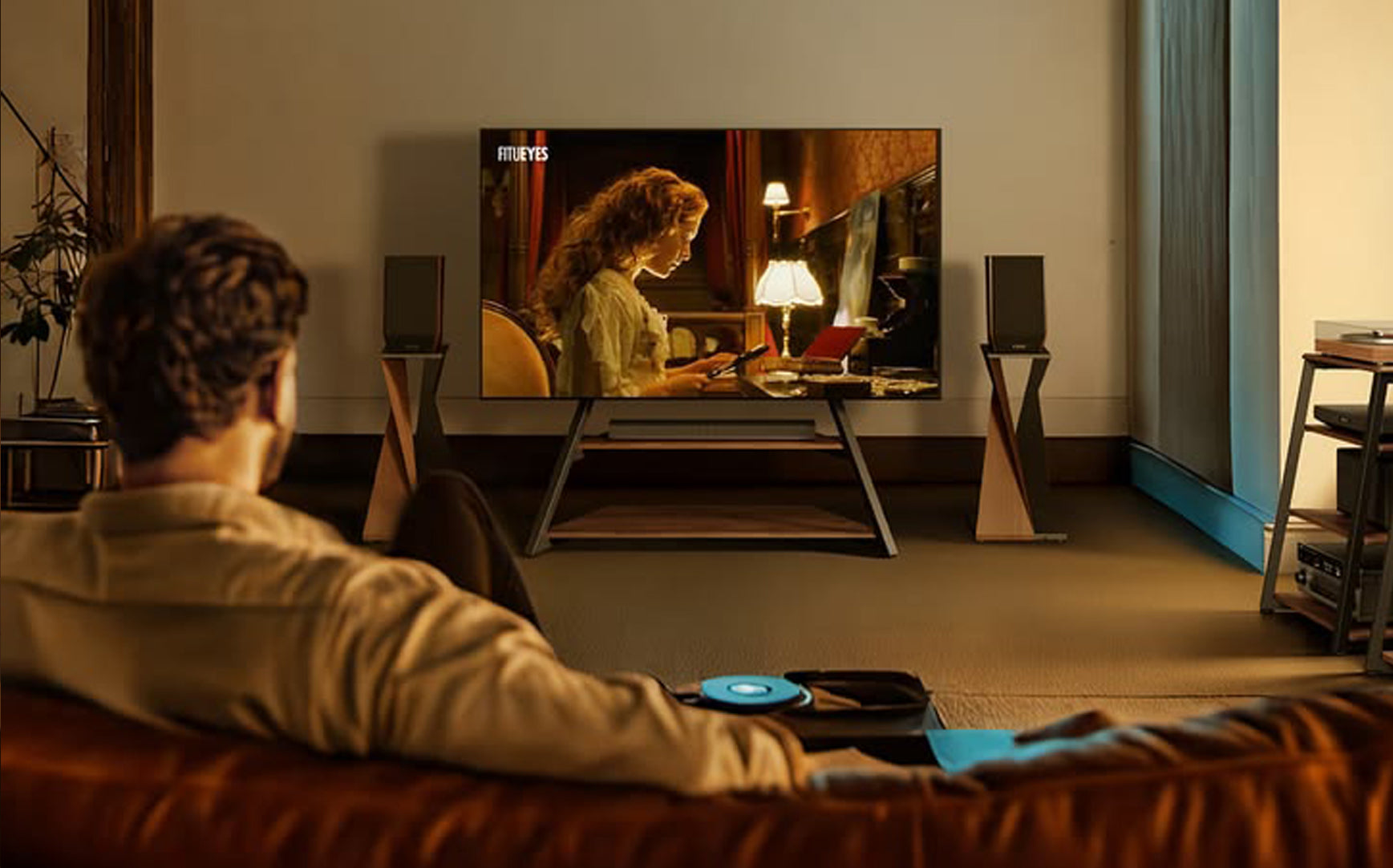 A listener watching a record-inspired performance in a complete home system